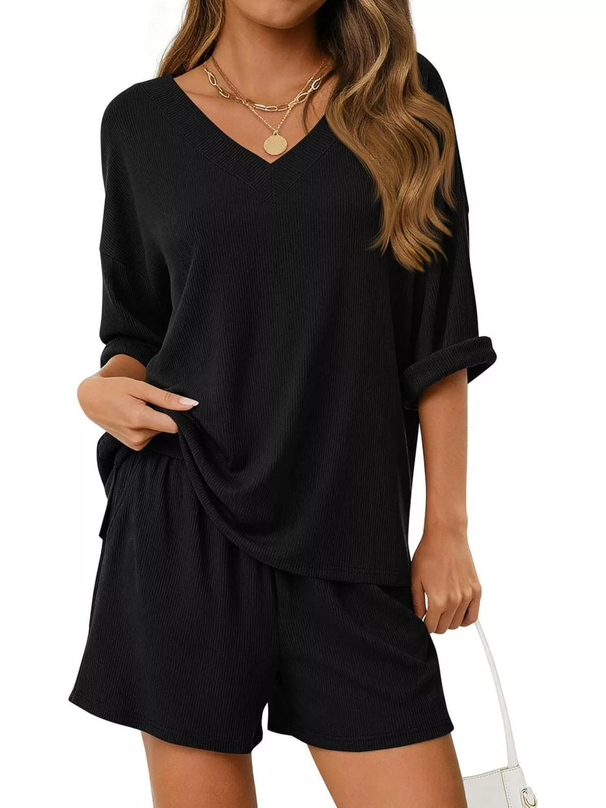 Women's casual V-neck top and shorts set in solid color, stylish two-piece outfit by Plush Fashion Hub.