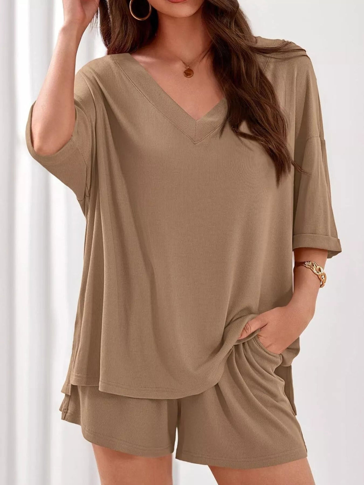 Women's casual V-neck top and shorts set by Plush Fashion Hub, solid color two-piece outfit, perfect for everyday wear.