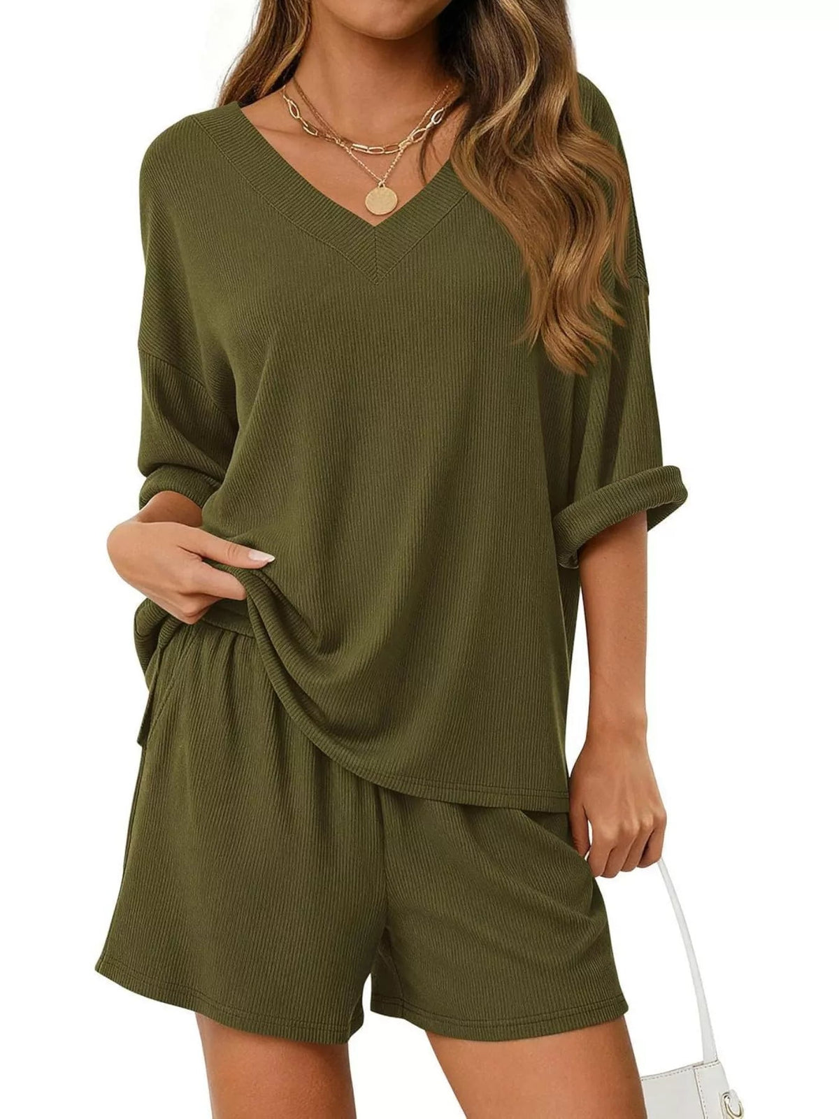 Women's casual V-neck top and shorts set by Plush Fashion Hub, solid color two-piece outfit, perfect for relaxed everyday wear.