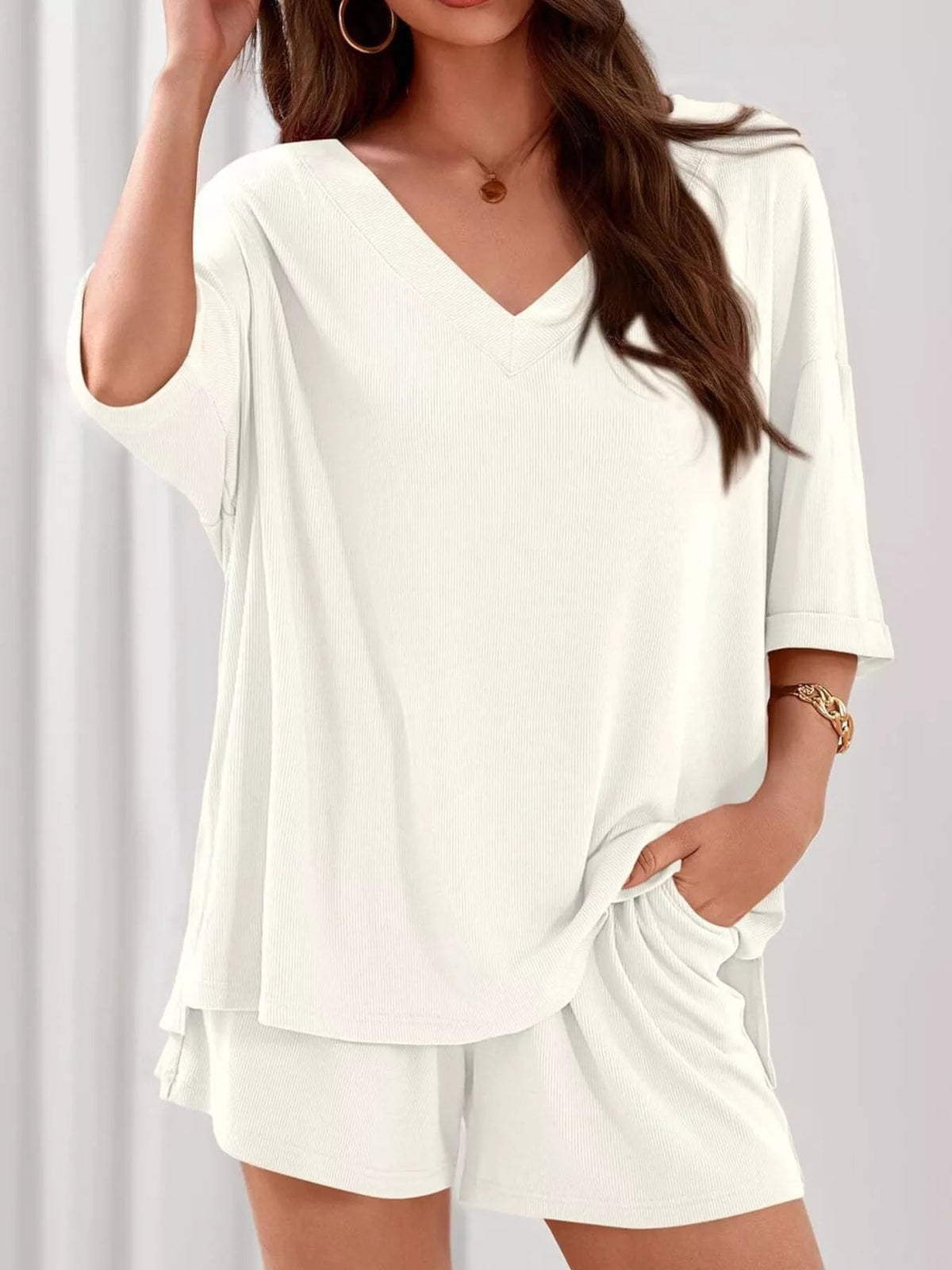 Women's casual V-neck top and shorts set in solid color, comfortable two-piece outfit by Plush Fashion Hub.