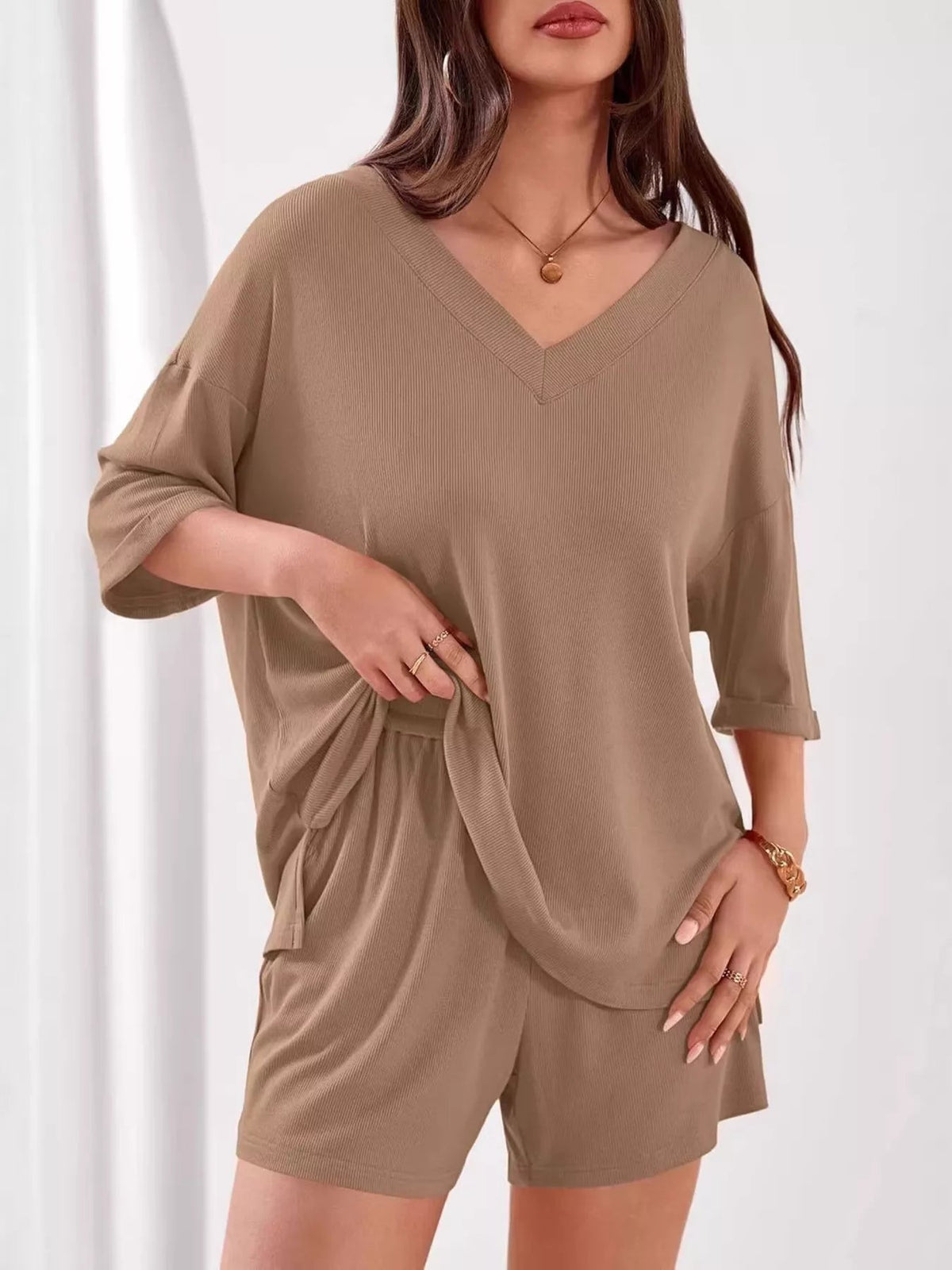 Women's casual V-neck top and shorts set in solid color, comfortable two-piece clothing outfit by Plush Fashion Hub.