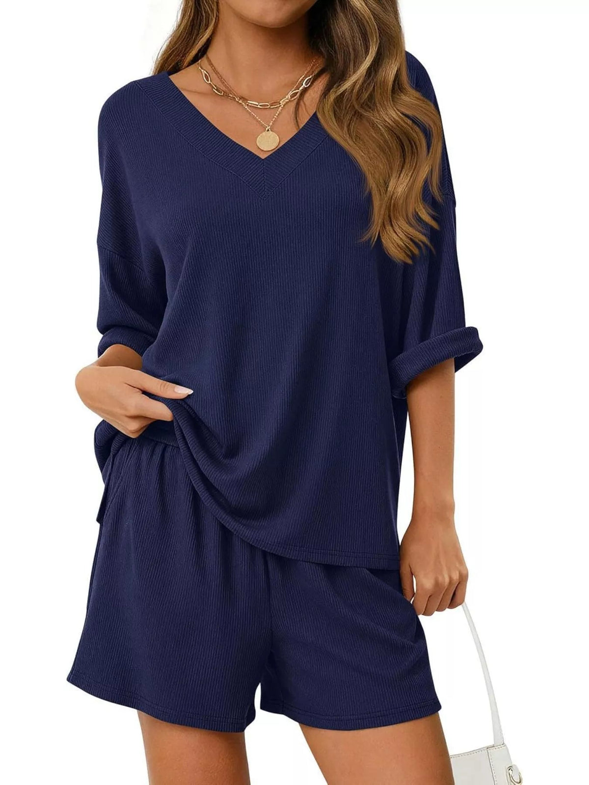 Women's casual V-neck top and shorts set in solid color, stylish two-piece outfit from Plush Fashion Hub.