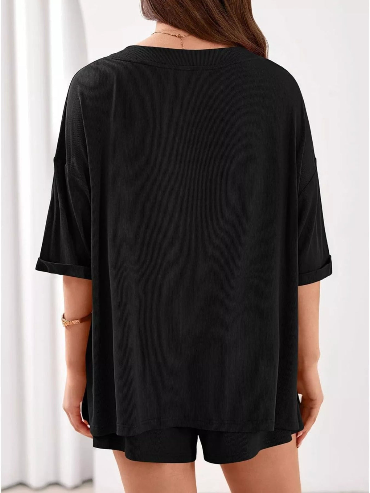 Women's casual V-neck top and shorts two-piece outfit in solid color, from Plush Fashion Hub, perfect for relaxed summer wear.