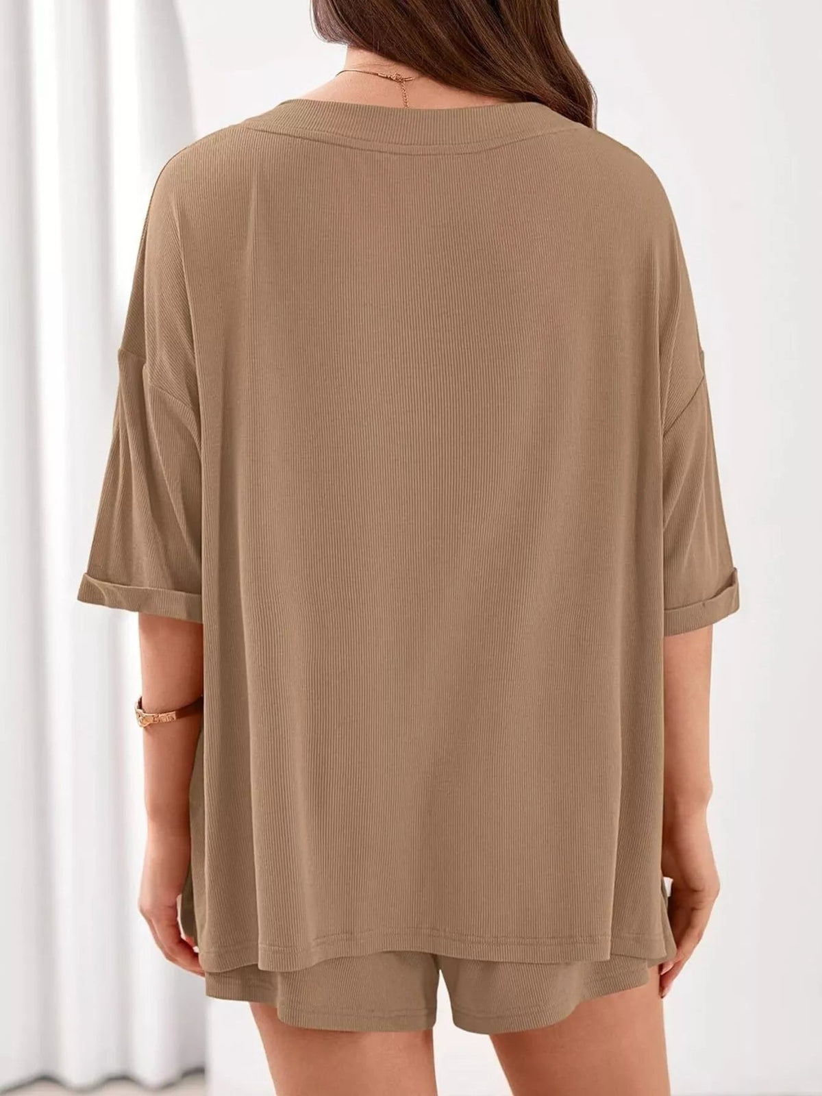 Women's casual V-neck top and shorts set by Plush Fashion Hub, solid color two-piece outfit, perfect for relaxed everyday wear.