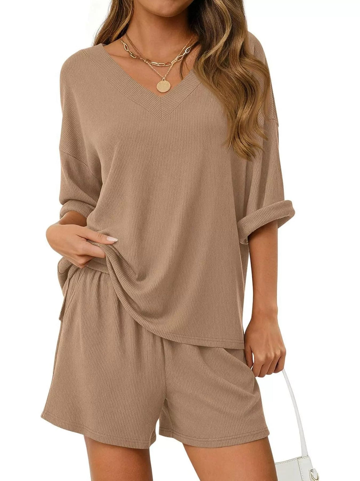 Women's casual V-neck top and shorts set by Plush Fashion Hub, solid color two-piece outfit, perfect for relaxed everyday wear.