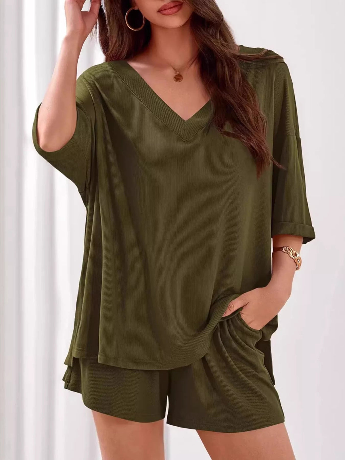Women's casual V-neck top and shorts set from Plush Fashion Hub, solid color two-piece outfit for relaxed everyday wear.