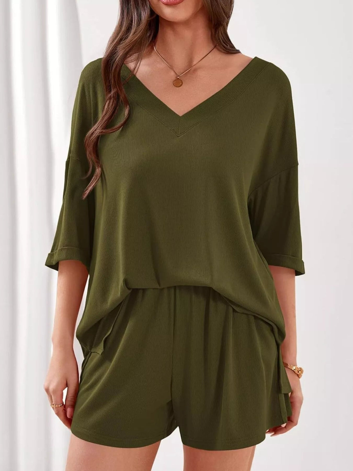 Women's casual V-neck top and shorts set by Plush Fashion Hub, solid color two-piece outfit, perfect for everyday wear.