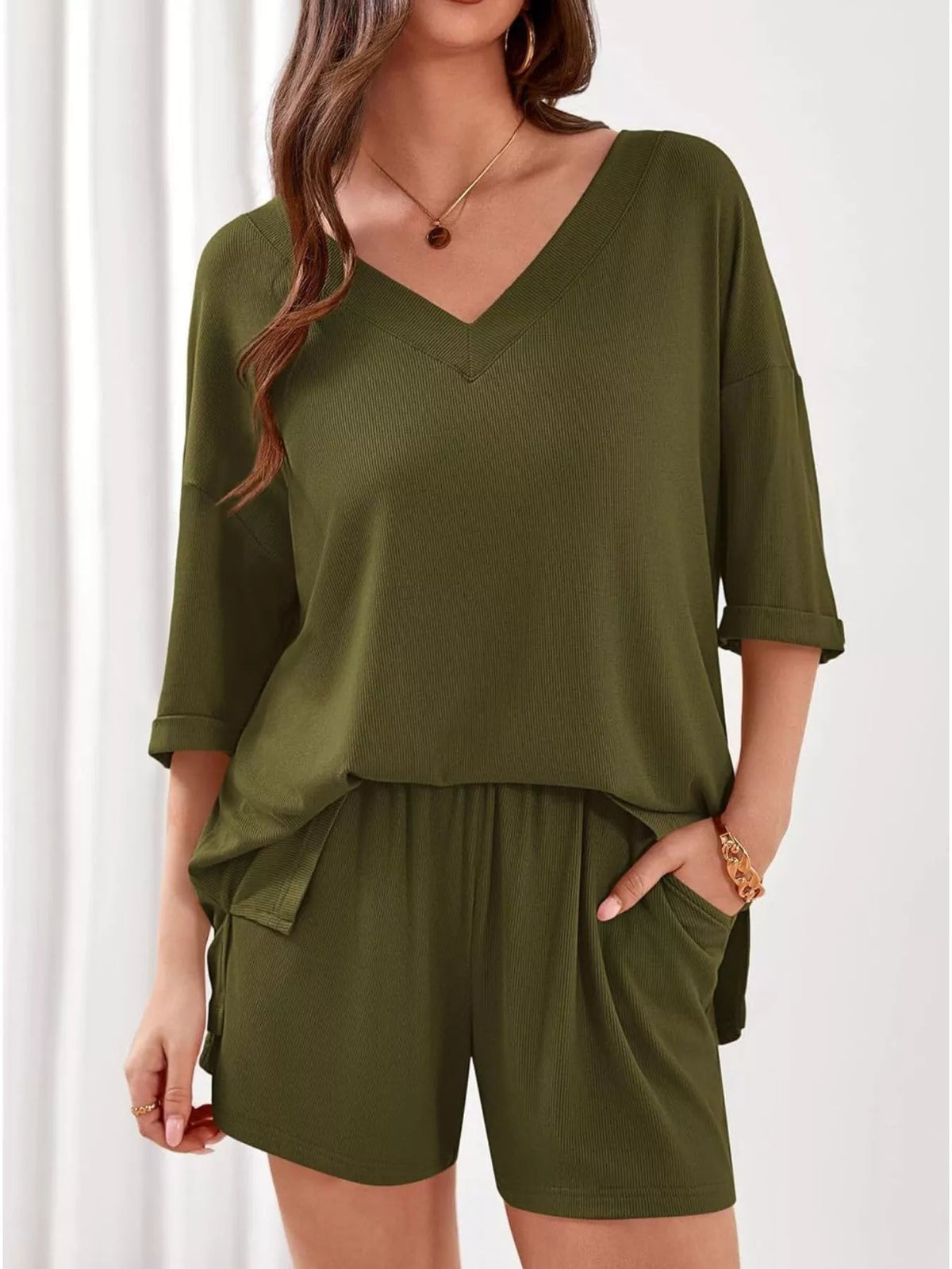 Women's casual V-neck top and shorts set in solid color, plush fabric, perfect for relaxed everyday wear.