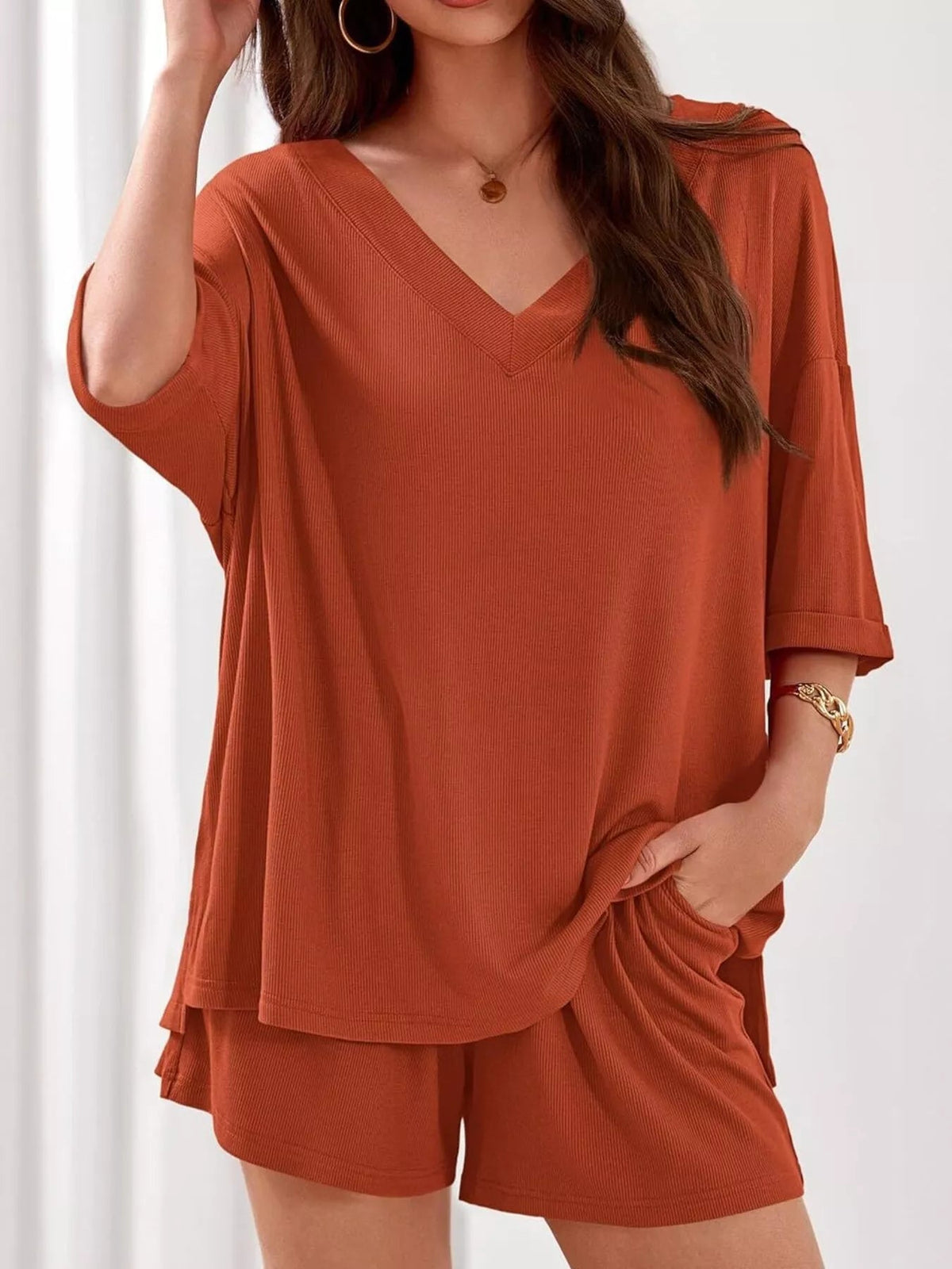Women's casual V-neck top and shorts set in solid color, two-piece outfit from Plush Fashion Hub. Comfortable and stylish clothing set.