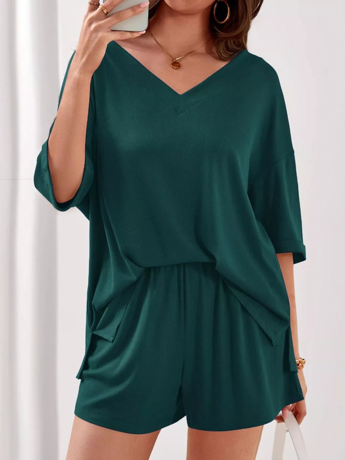Women's casual V-neck top and shorts set in solid color, comfortable two-piece outfit by Plush Fashion Hub.