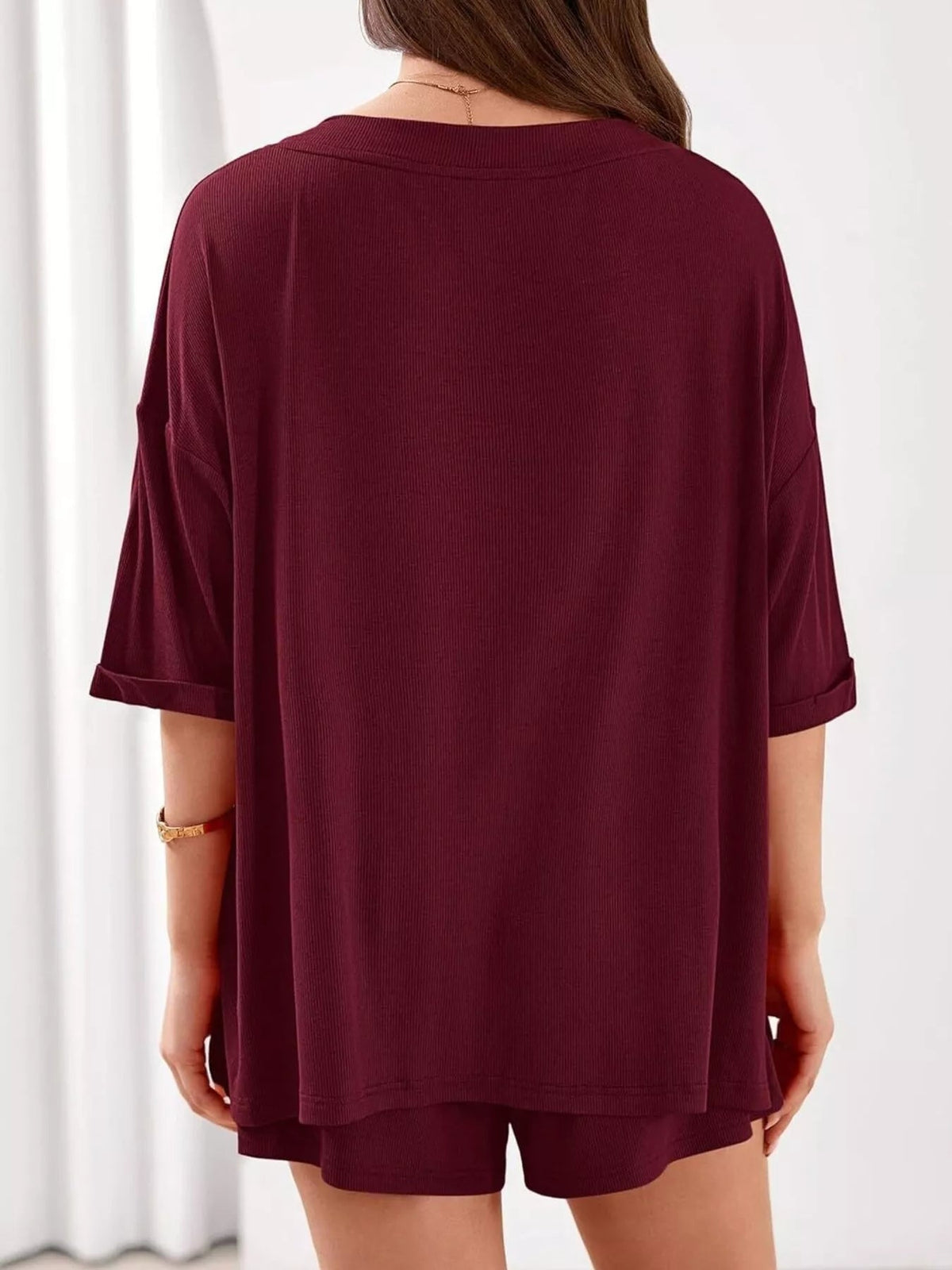 Women's casual V-neck top and shorts set in solid color, Plush Fashion Hub two-piece clothing outfit, perfect for relaxed wear.