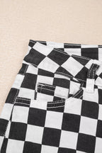 Women's checkerboard print distressed raw edge cropped jeans by Trendsi, featuring a stylish pattern and frayed hem detail.