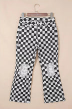 Women's checkerboard print distressed raw edge cropped jeans from Trendsi, featuring a trendy pattern and frayed hem detail.