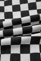 Women’s checkerboard print distressed raw edge cropped jeans by Trendsi, featuring a fashionable checkered pattern and frayed hems.