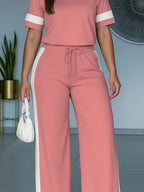 Women's color-block contrast 2-piece casual outfit by FitiqueFit, featuring a stylish top and matching pants set.