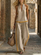 Women’s contrast color sleeveless vest and wide-leg pants set by FitiqueFit, casualwear with stylish sleeveless top and flowy pants.