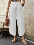 Women's cotton-linen cropped drawstring pants by FitiqueFit, casualwear with a relaxed fit and adjustable waist.