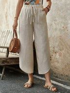Women's cotton-linen cropped drawstring pants by FitiqueFit, casualwear with a relaxed fit and comfortable waist.