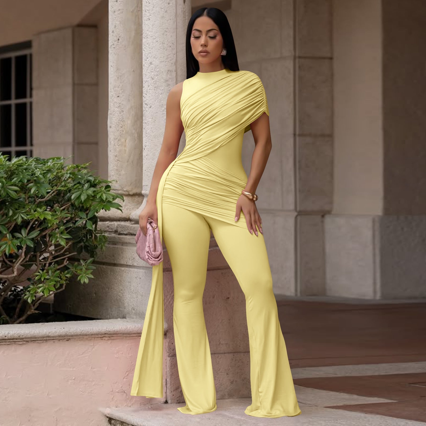 Women's casual FitiqueFit crew-neck pleated ribbon flare jumpsuit, with wide legs and stylish design, shown on a model.