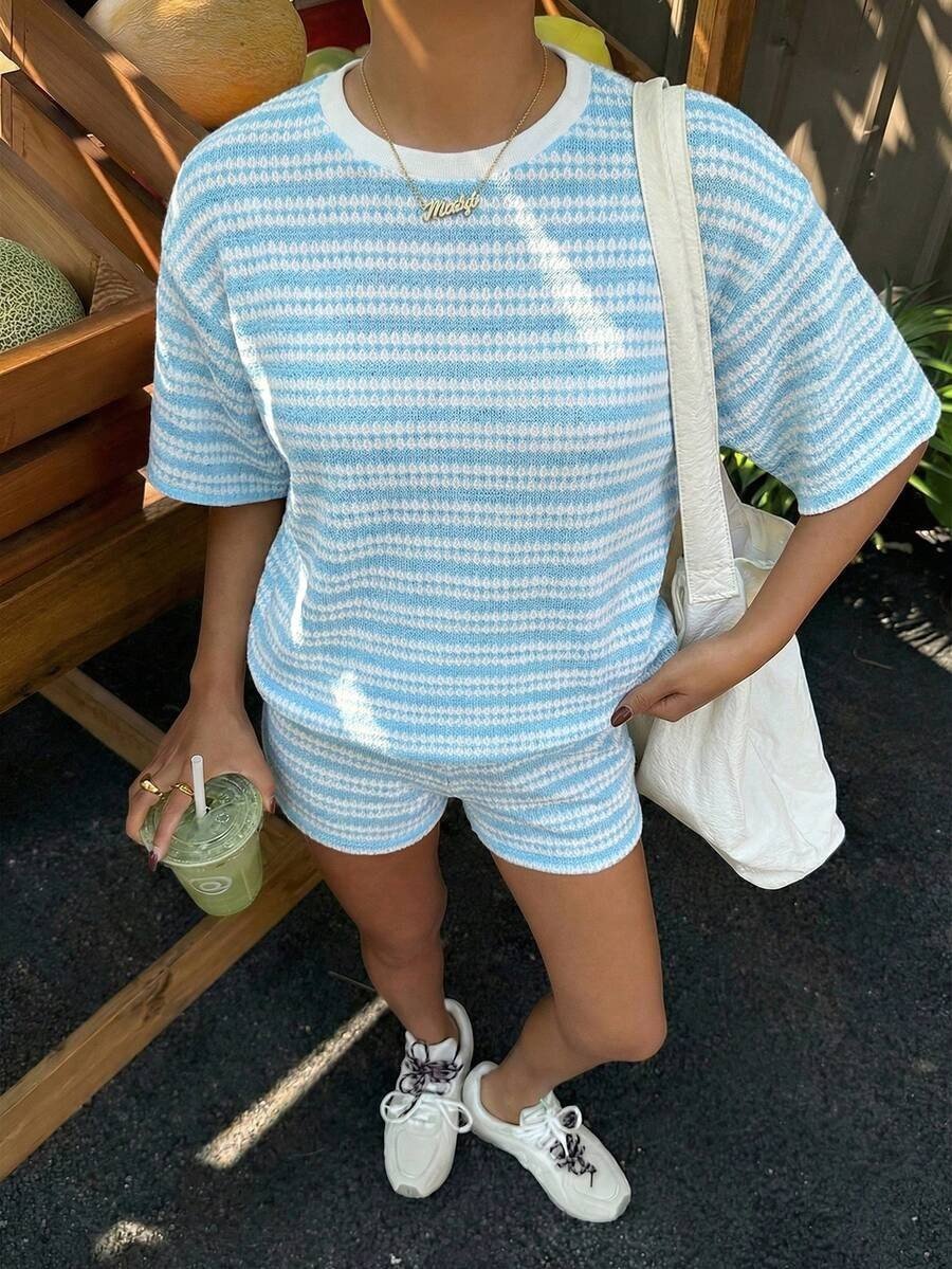 Women's casual FitiqueFit crew-neck spliced short-sleeve T-shirt and matching shorts set, displayed on a model.