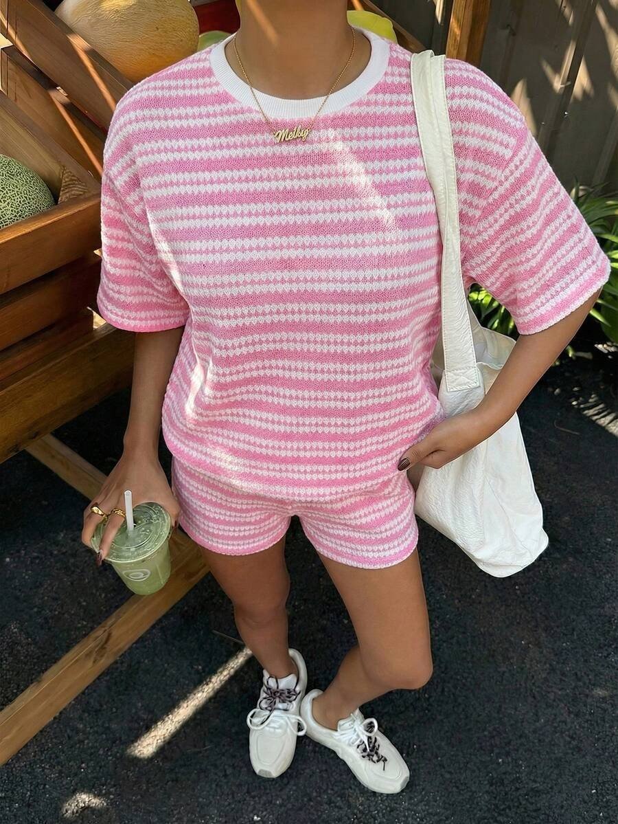 Women's casual FitiqueFit crew-neck spliced short-sleeve T-shirt and shorts set, shown on a model in a relaxed outdoor setting.