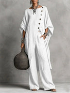 Women's casual drop shoulder three-quarter sleeve irregular shirt and pants set by FitiqueFit, shown in a relaxed, stylish fit.