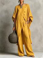 Women's casualwear set with drop shoulder three-quarter sleeve irregular shirt and matching pants by FitiqueFit.