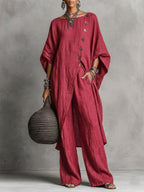 Women's casualwear set by FitiqueFit featuring a drop shoulder three-quarter sleeve irregular shirt and matching pants.