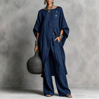 Women's casualwear set by FitiqueFit featuring a drop shoulder three-quarter sleeve irregular shirt and matching pants.