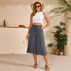 Women’s elastic cropped wide-leg pants by FitiqueFit, casualwear style, shown in beige with a high waist and relaxed fit.