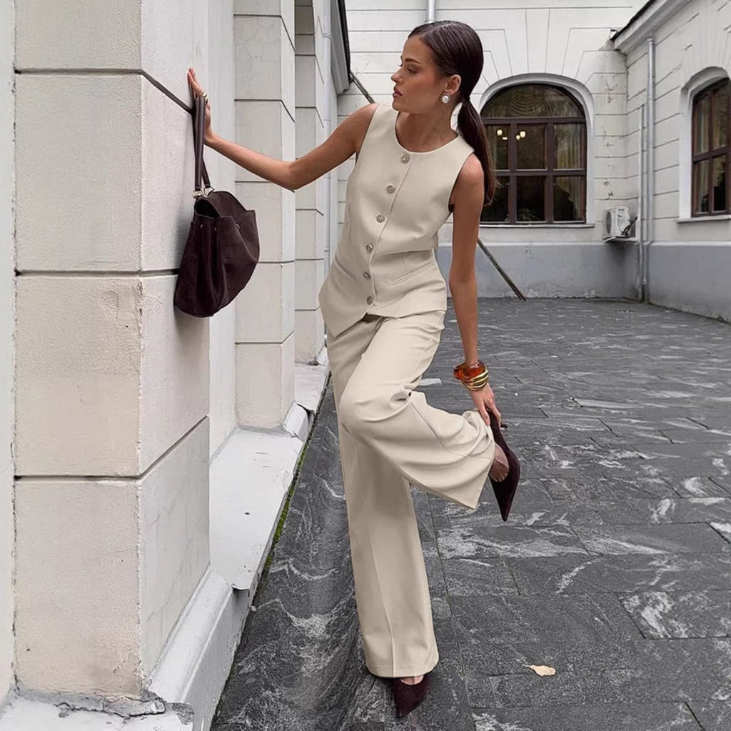 Women's elegant sleeveless vest and wide-leg pants set by FitiqueFit, perfect for office casualwear, shown on a model.