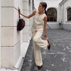 Women's elegant sleeveless vest and wide-leg pants set by FitiqueFit, perfect for office casualwear, shown on a model.