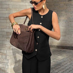 Women's elegant sleeveless vest and wide-leg pants set by FitiqueFit, perfect for office casualwear, shown in a stylish two-piece ensemble.