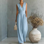 Women's elegant sleeveless V-neck jumpsuit with waist cinching and straight leg design, casualwear by Plush Fashion Hub.