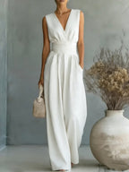 Women's elegant sleeveless V-neck jumpsuit with waist cinching design and straight leg fit, casualwear by Plush Fashion Hub.