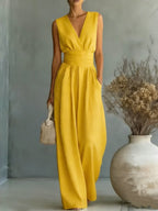 Women's elegant sleeveless V-neck jumpsuit by Plush Fashion Hub featuring a waist-cinching fit and straight-leg design for casual wear.