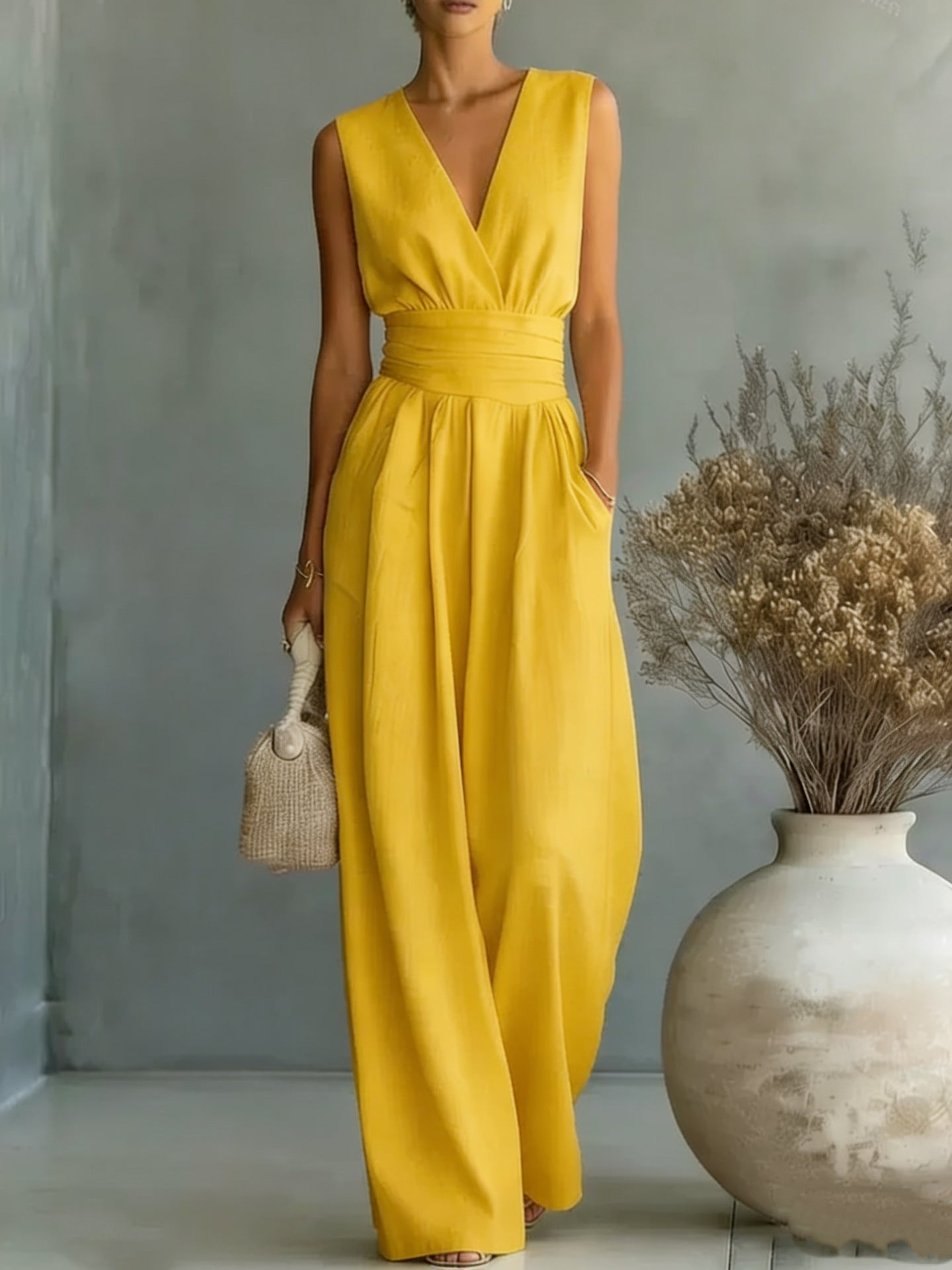 Women's elegant sleeveless V-neck jumpsuit by Plush Fashion Hub featuring a waist-cinching fit and straight-leg design for casual wear.