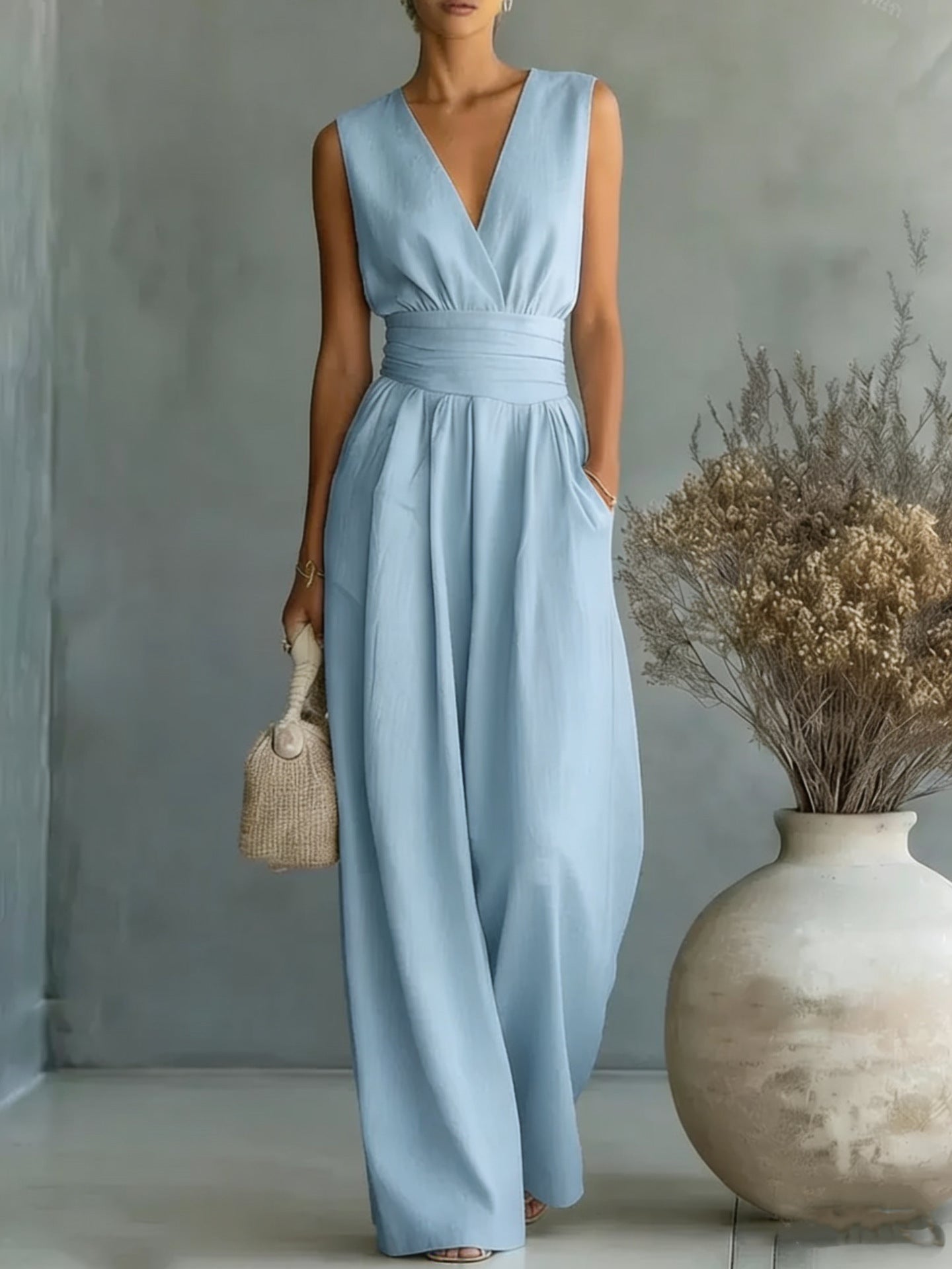 Women's elegant sleeveless V-neck jumpsuit with waist detail and straight-leg cut, casualwear from Plush Fashion Hub.