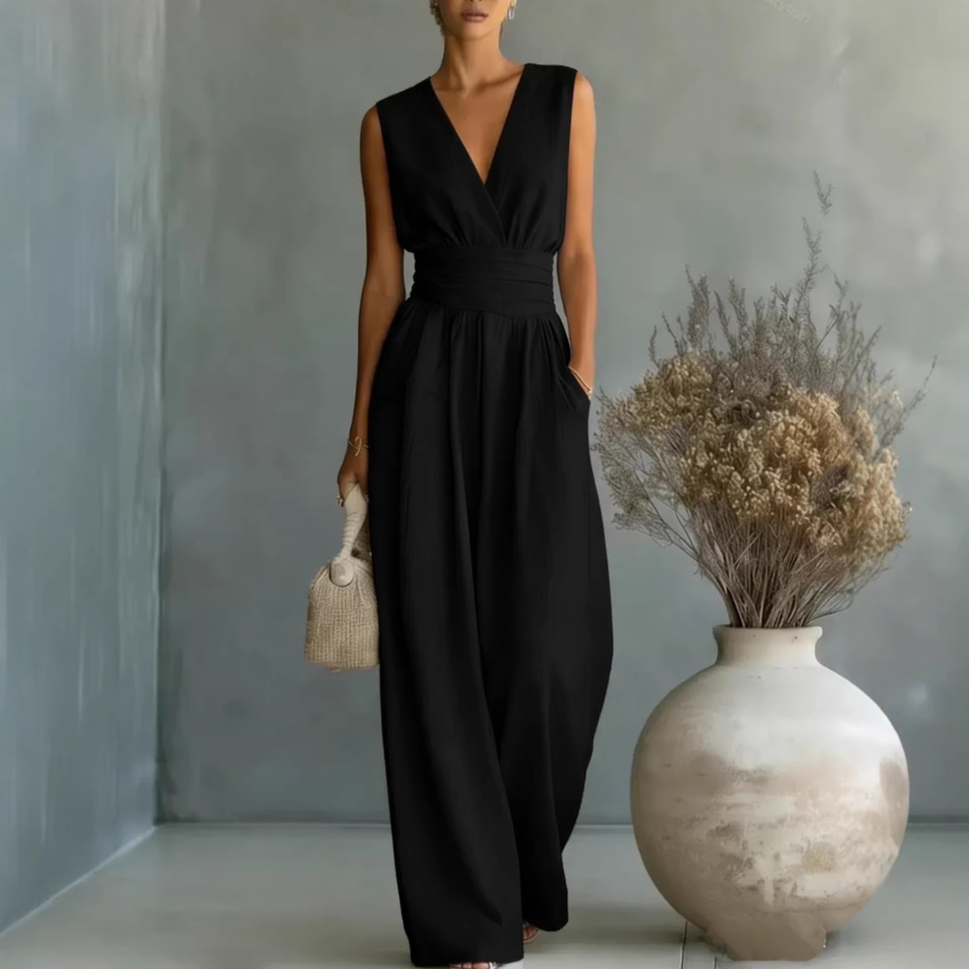 Women's elegant V-neck sleeveless jumpsuit by Plush Fashion Hub featuring a waist-cinching fit and straight-leg casual style.