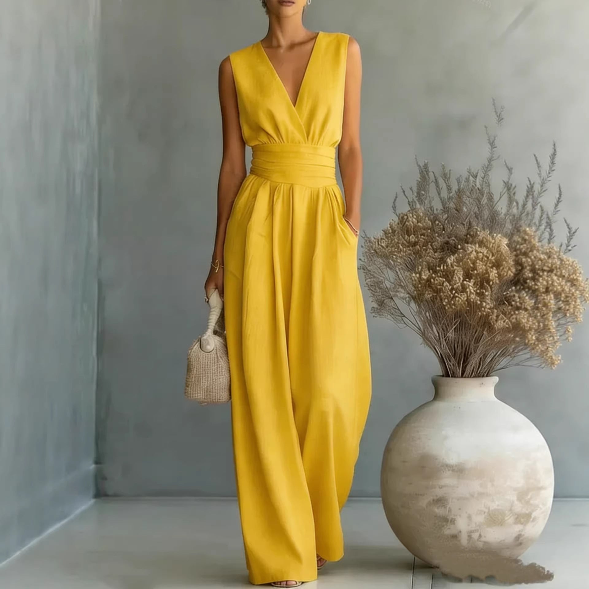 Women's elegant V-neck sleeveless jumpsuit by Plush Fashion Hub, featuring a waist-cinching fit and straight-leg casual design.