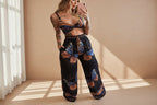 Women's feather print crop top and pants set by FitiqueFit, casual 2-piece vacation outfit with stylish, lightweight fabric.