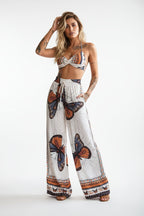 Women's feather print crop top and pants set by FitiqueFit, casual 2-piece vacation outfit with stylish lightweight fabric.