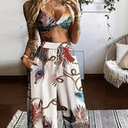 Women's feather print crop top and pants set by FitiqueFit, casual 2-piece vacation outfit shown in the image.
