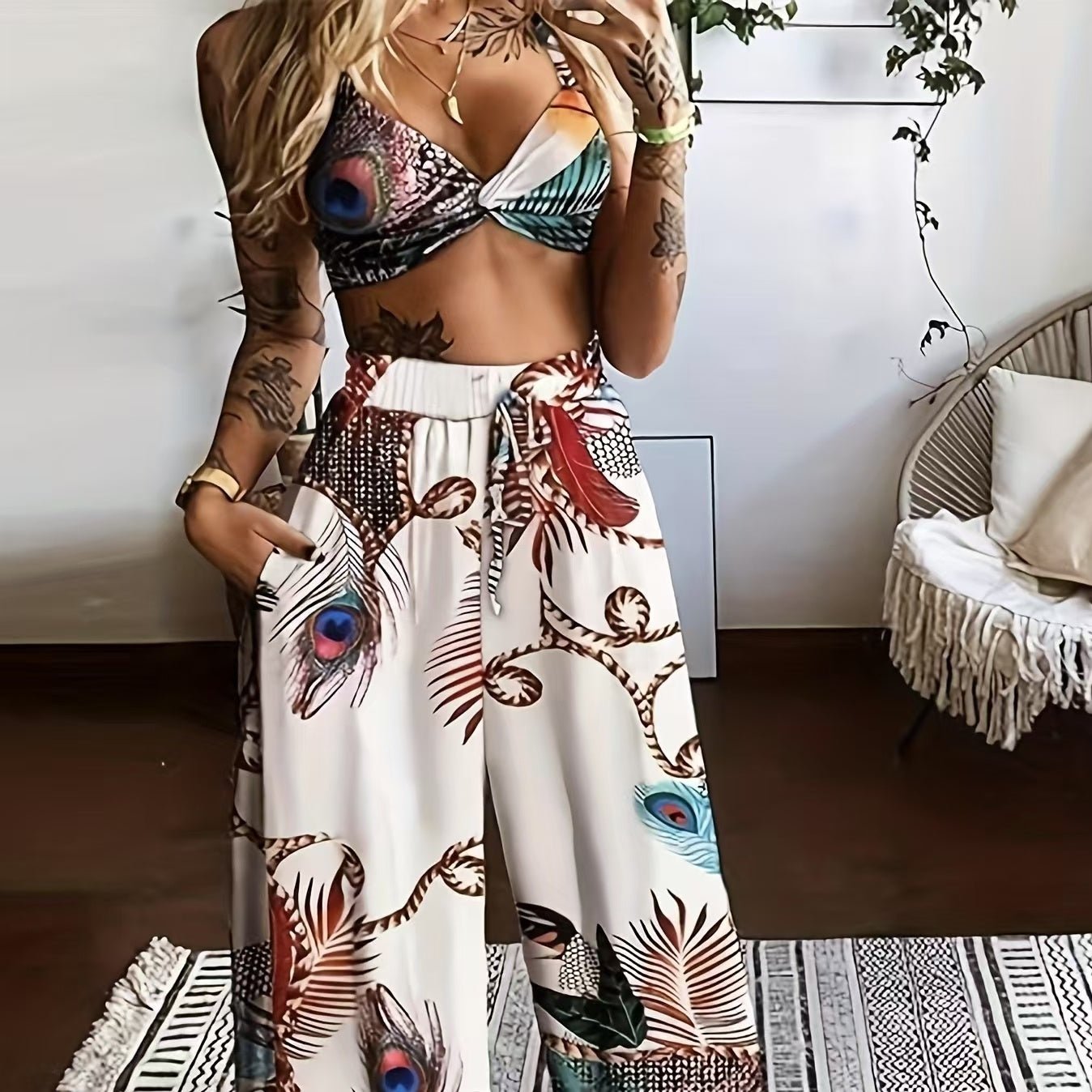 Women's feather print crop top and pants set by FitiqueFit, casual 2-piece vacation outfit shown in the image.