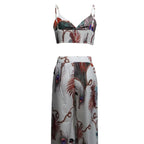 Women's feather print crop top and matching pants set, casualwear by FitiqueFit, perfect for vacation or relaxed outings.