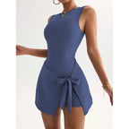 Women's FitiqueFit sleeveless mini yoga dress with a stylish back design, perfect for fitness and casual wear.