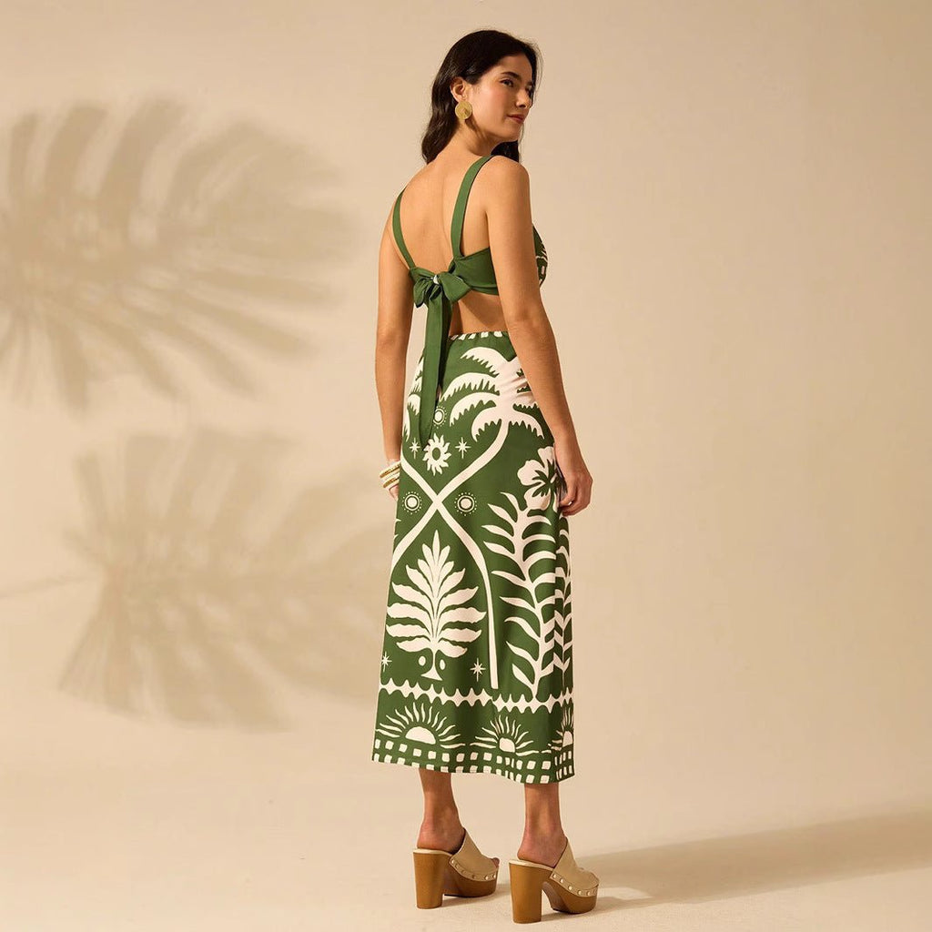 Women's floral printed camisole and high-waisted midi skirt set by FitiqueFit, featuring a casual, stylish look with vibrant floral design.