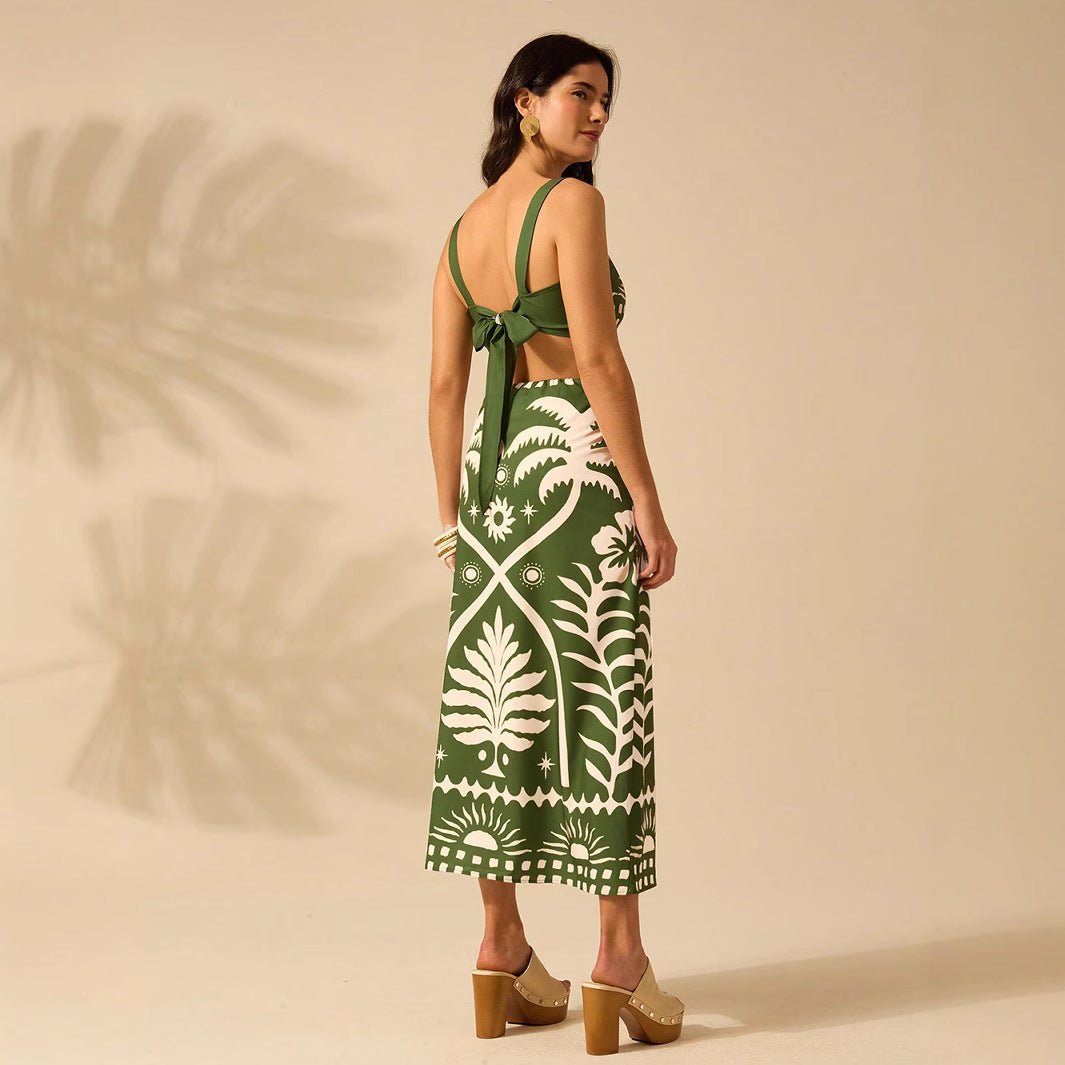 Women's floral printed camisole and high-waisted midi skirt set by FitiqueFit, featuring a casual, stylish look with vibrant floral design.
