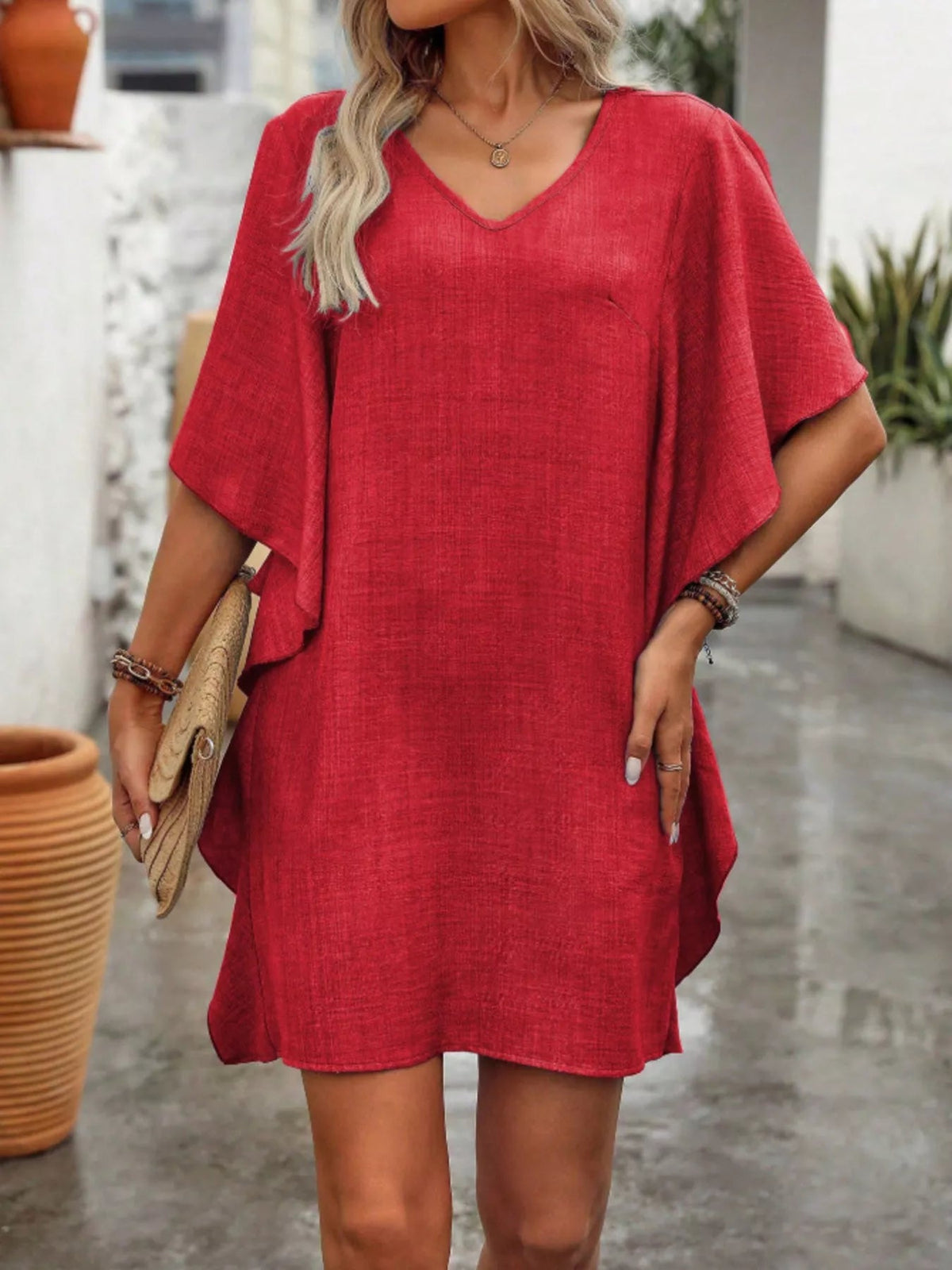 Women’s flowy V-neck casual mini dress with ruffled sleeves from Plush Fashion Hub, featuring lightweight fabric and relaxed fit.