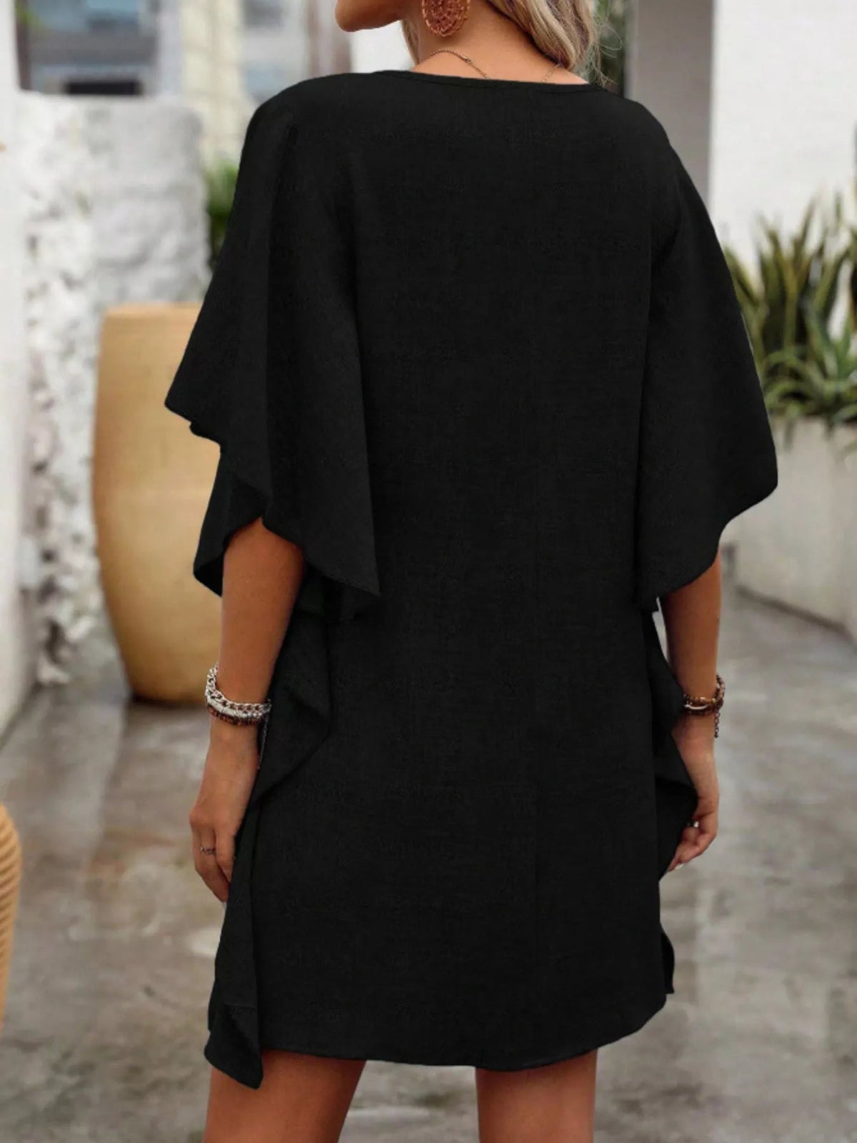 Women’s flowy V-neck casual mini dress with ruffled sleeves, stylish and comfortable from Plush Fashion Hub.